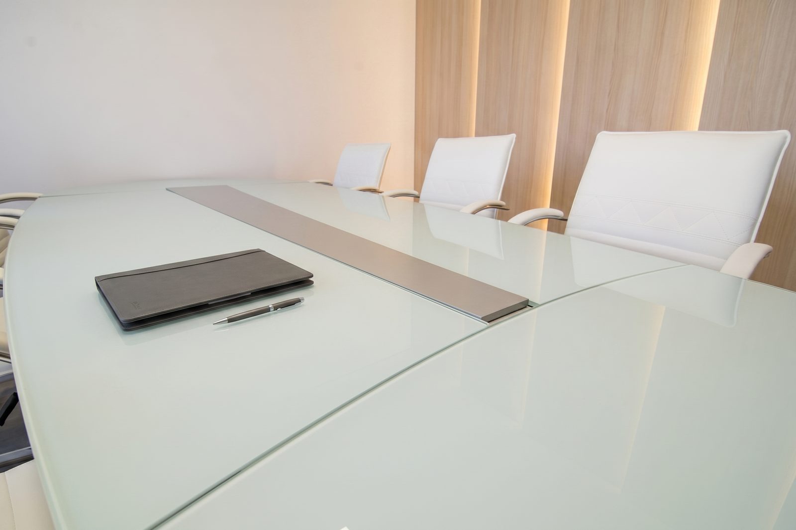 After: the same table in front of a warm wood-slat wall